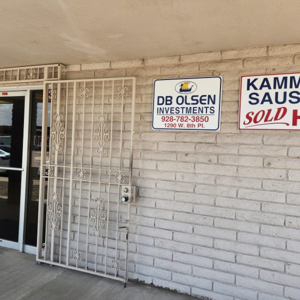 Storefront of DB Olsen Investments at 1290 W. 8th Pl. in Yuma, with the business sign beside the entrance